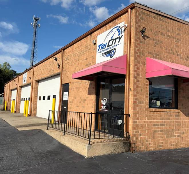Mechanic performing vehicle diagnostics at Tri City Transmission
